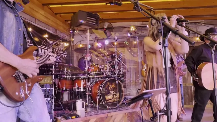 The full band on the barn stage